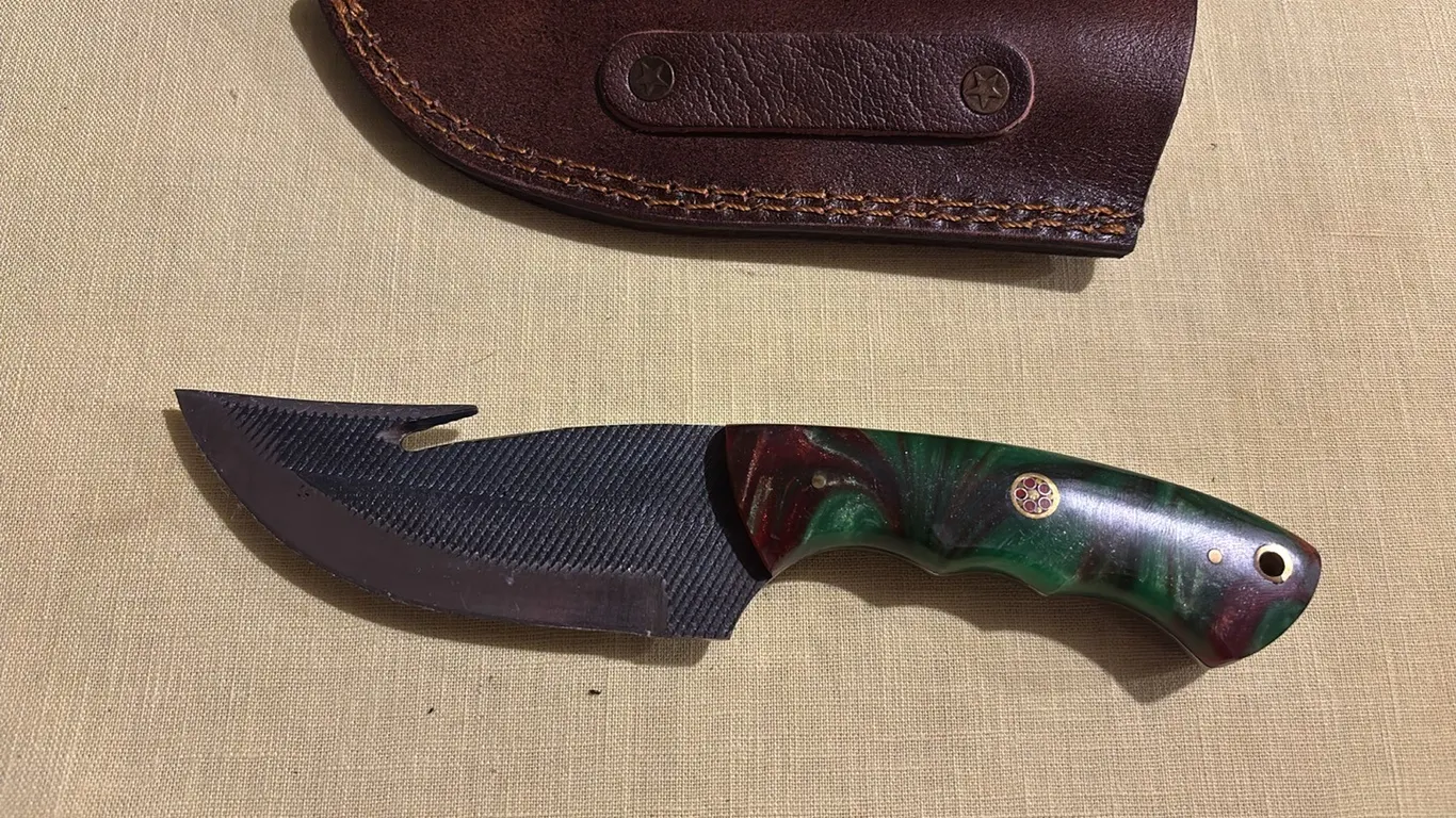 Damascus steel knife with gut hook