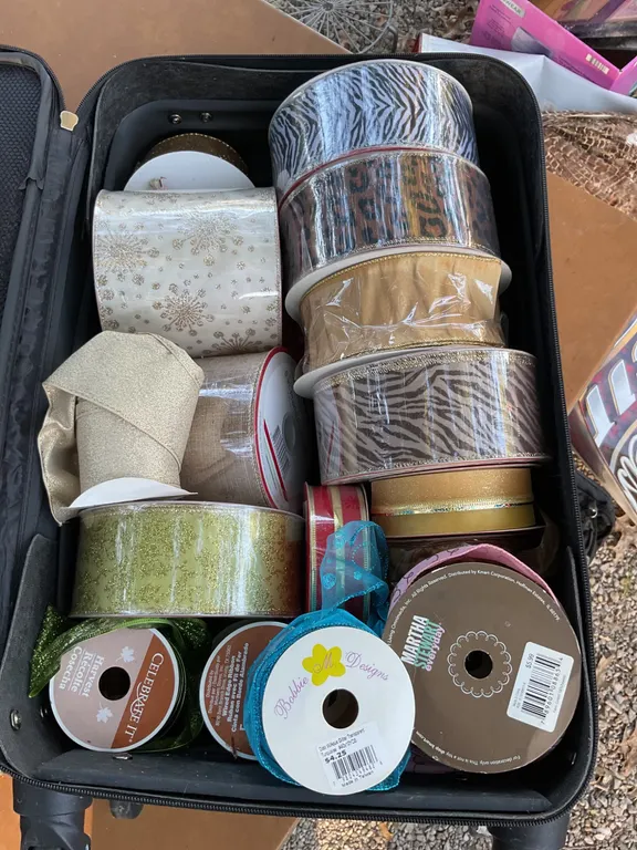 Two Rolling Suitcases with Assorted Ribbon Spools