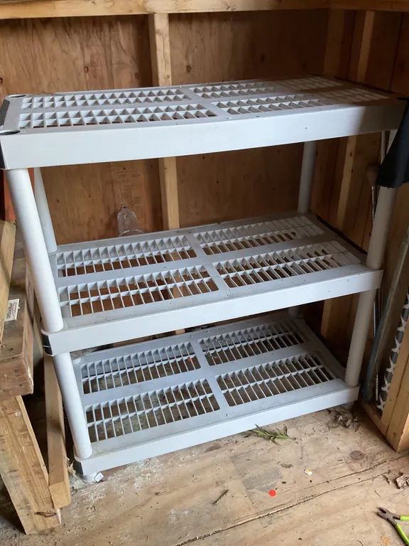 2 Identical Plastic Ventilated Storage Shelves