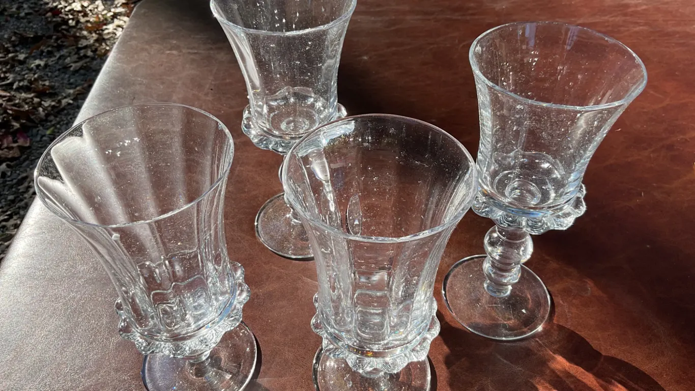 Four Clear Pressed Glass Goblets with Ornate Stems