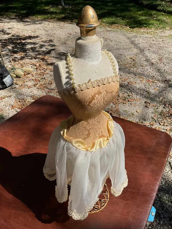 Decorative Mannequin with Gold and White Fabric Dress