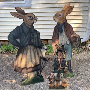 Three Hand-Painted Wooden Rabbit Figures in Period Attire