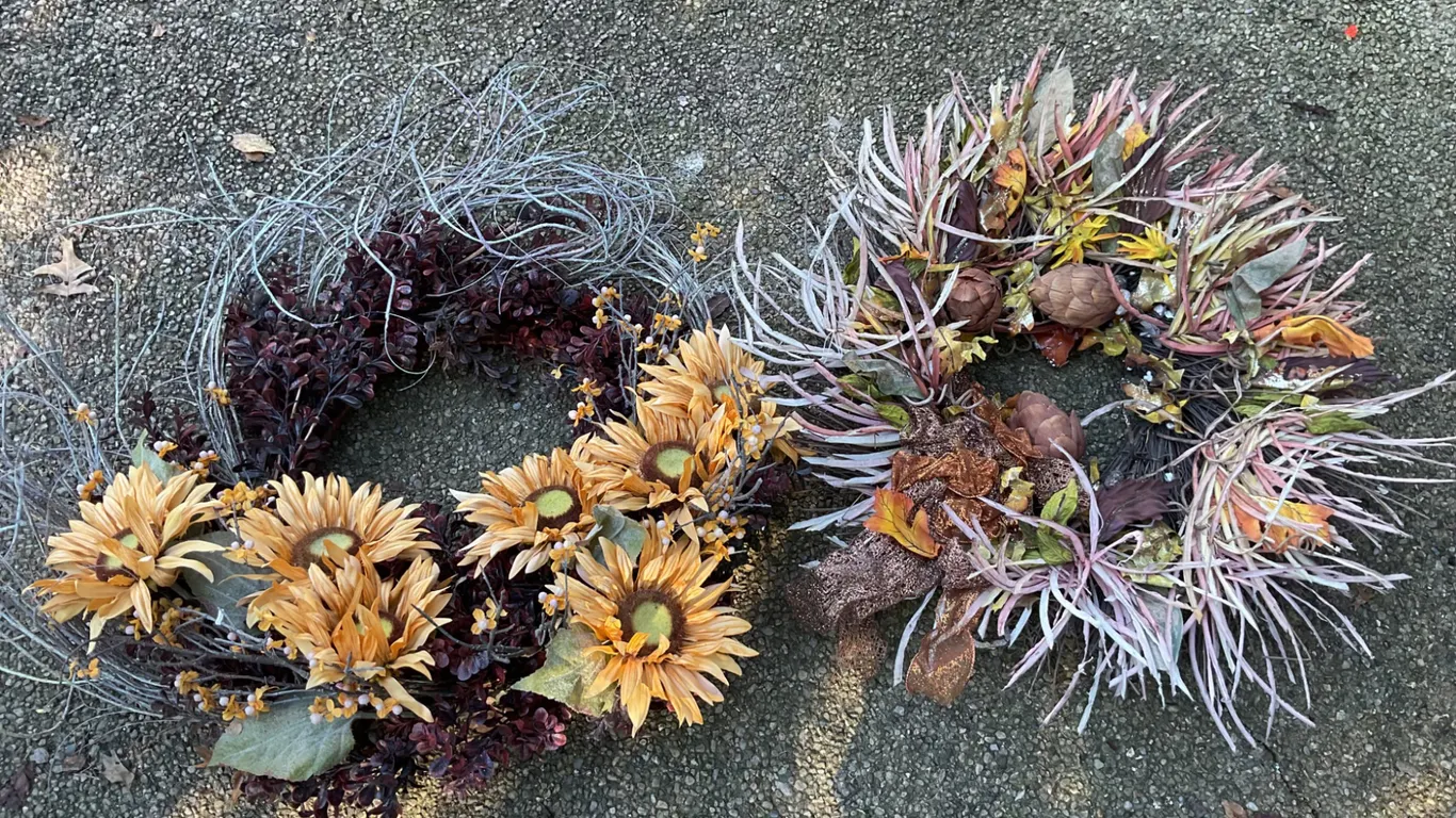 Two Decorative Wreaths with Floral and Foliage Details