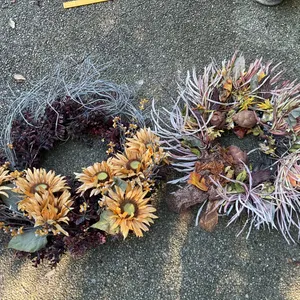 Two Decorative Wreaths with Floral and Foliage Details