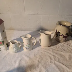 4 ceramic pitchers and pasta holder