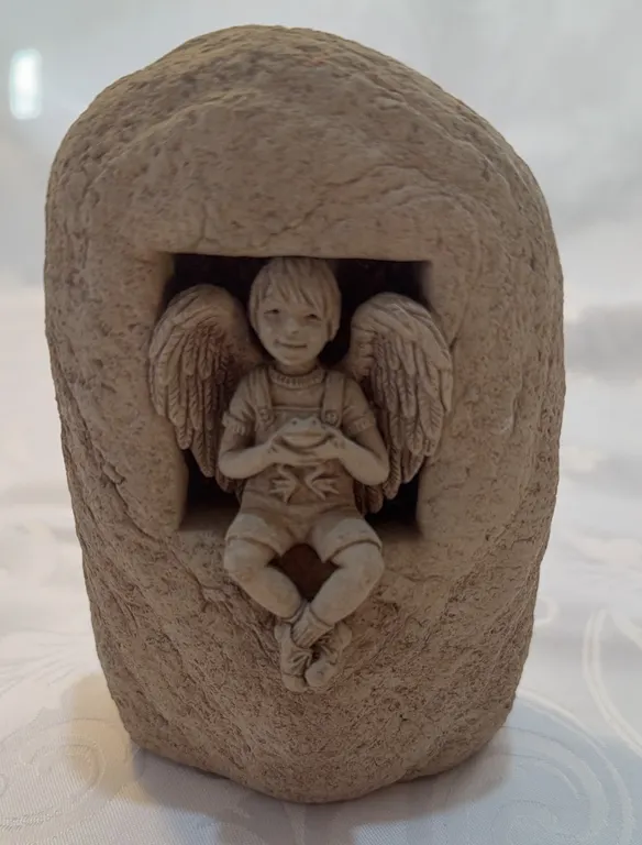 Window Angel cast stone sculpture by Carruth Studio.