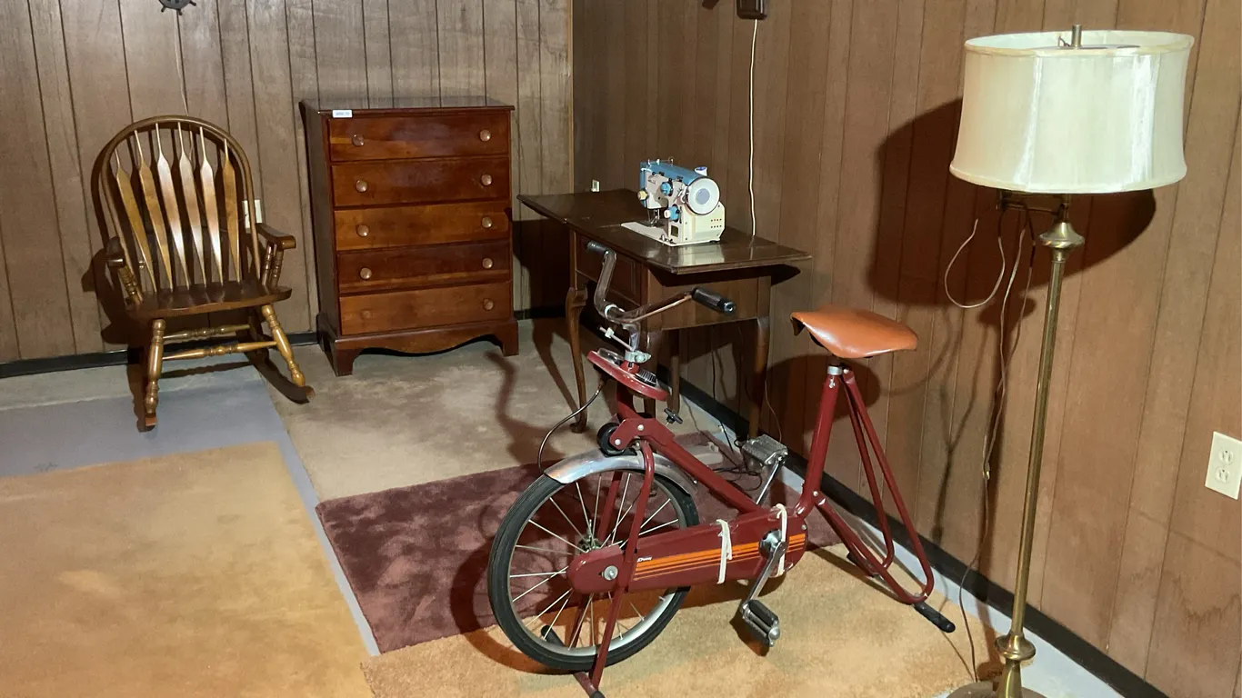 Dresser, exercise bike, floor lamp, chair, sewing machine