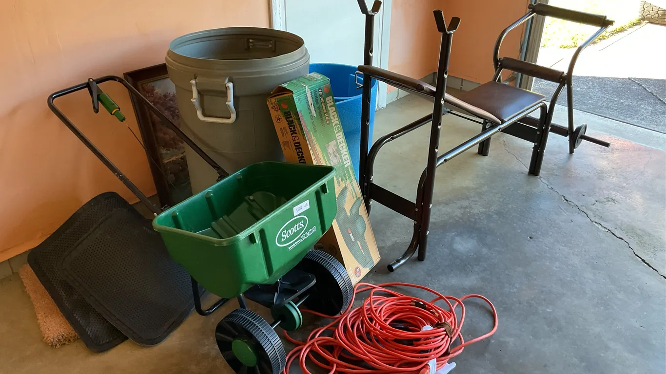 Hedge trimmers, extension cord, lawn spreader, trash can