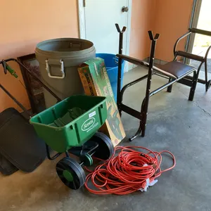 Hedge trimmers, extension cord, lawn spreader, trash can