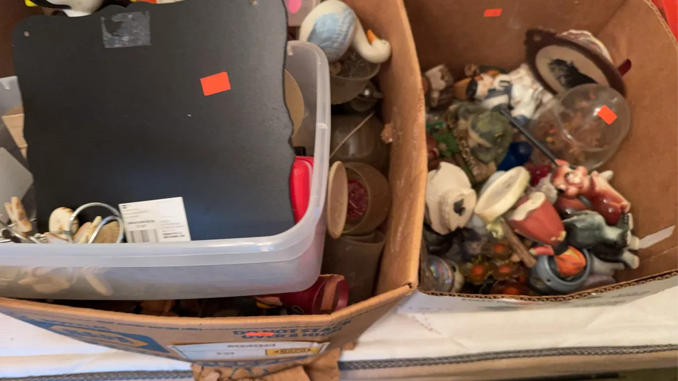 Boxes of figurines and glassware