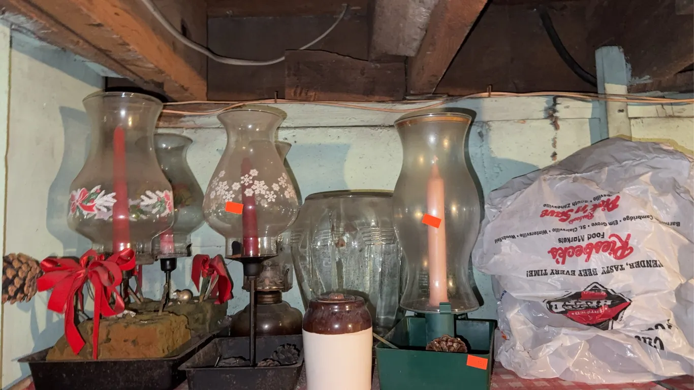 Contents of top shelf candles glass globes light bulbs