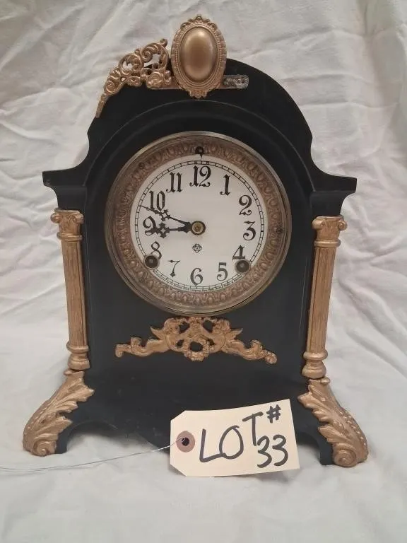 Ornate Black Mantel Clock with Gold-Tone Mounts an