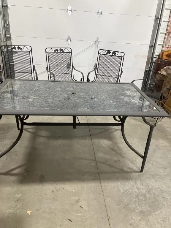 Metal/glass patio table 66x40x28 & four metal