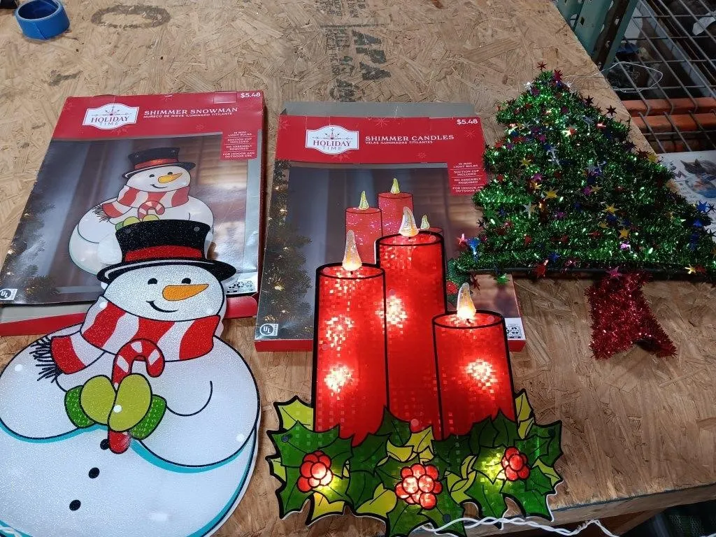 Holiday Time decor. Light up candle and snowman,