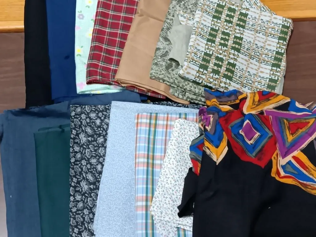 Large box of fabric. Many interesting patterns,