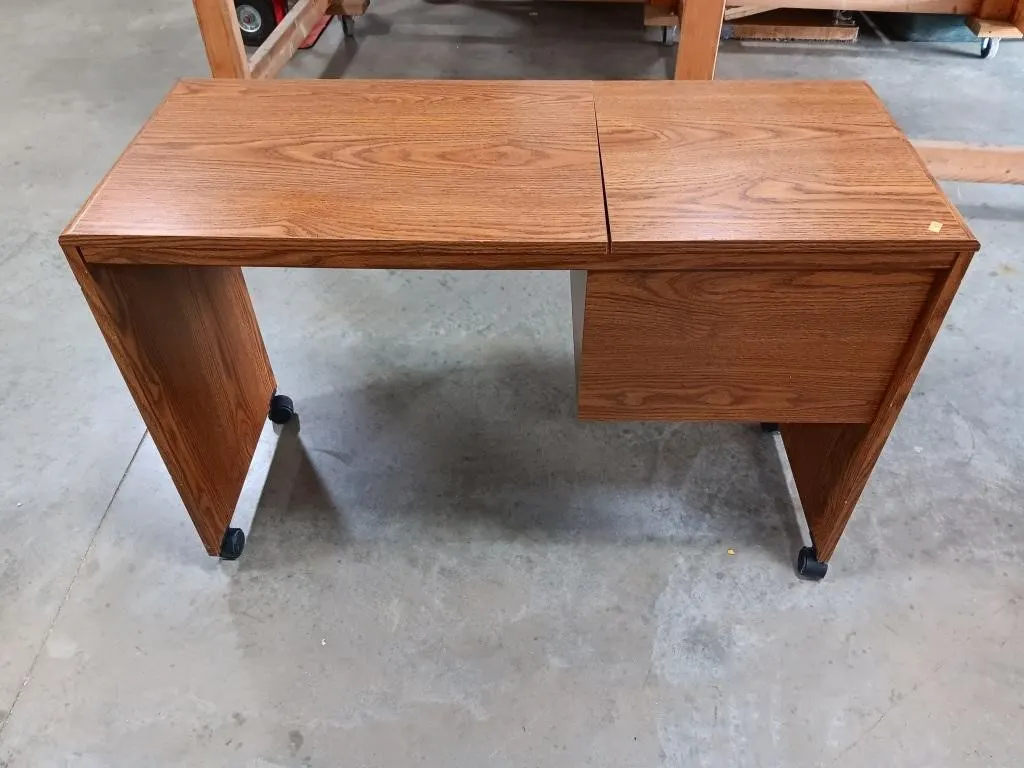 Rolling wooden storage cabinet.