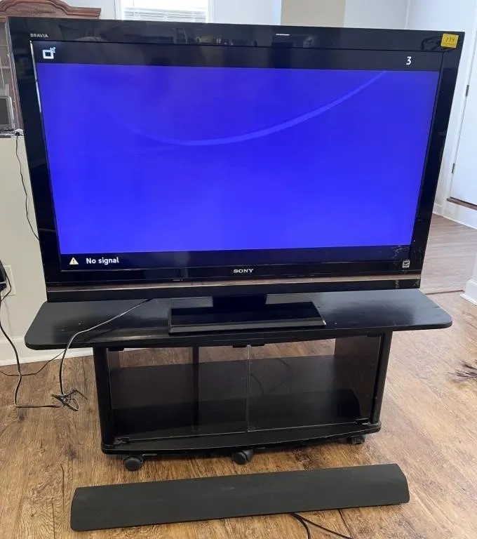 46" Sony tv, bar speaker, rolling stand
