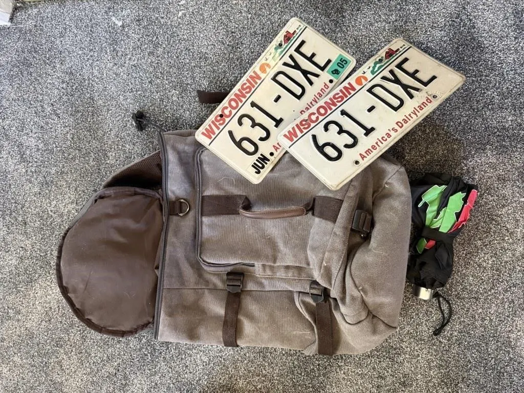 Backpack, license plates, umbrella