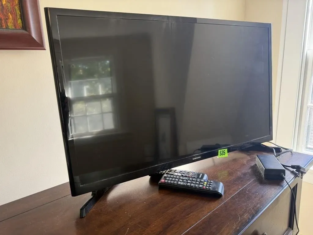 Samsung 32" television, remote controls