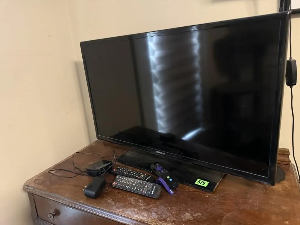 Samsung 32" television, remote controls, Roku