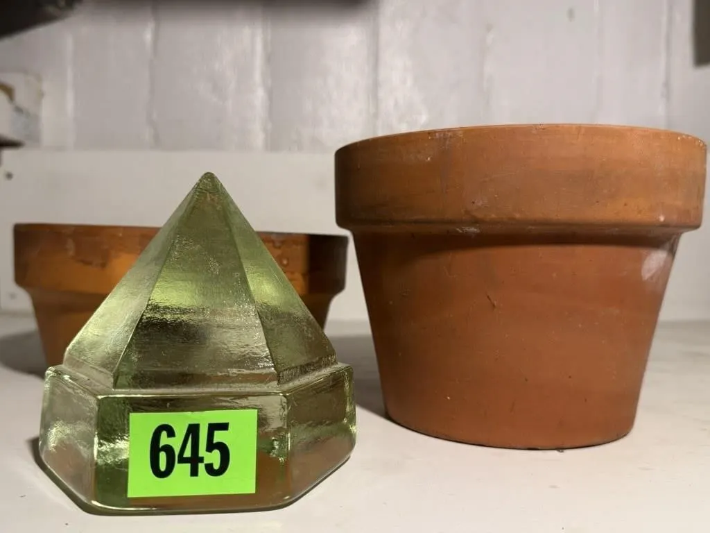 Clay pots, glass pyramid