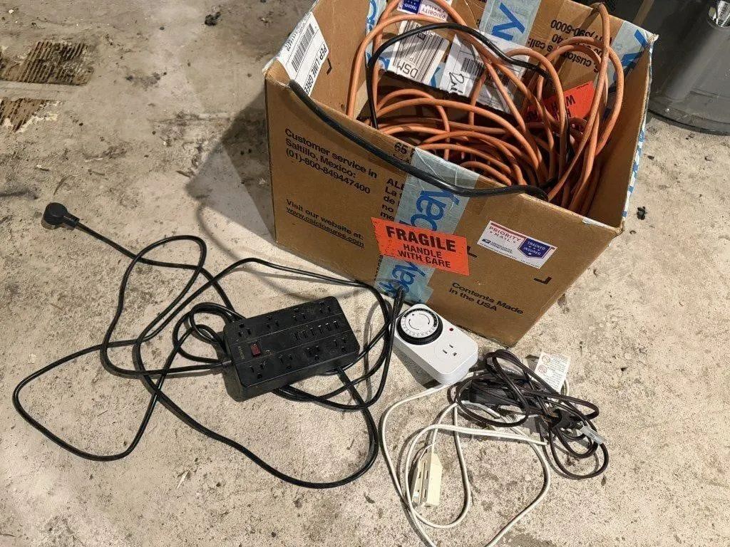 Box of power cords, surge protectors
