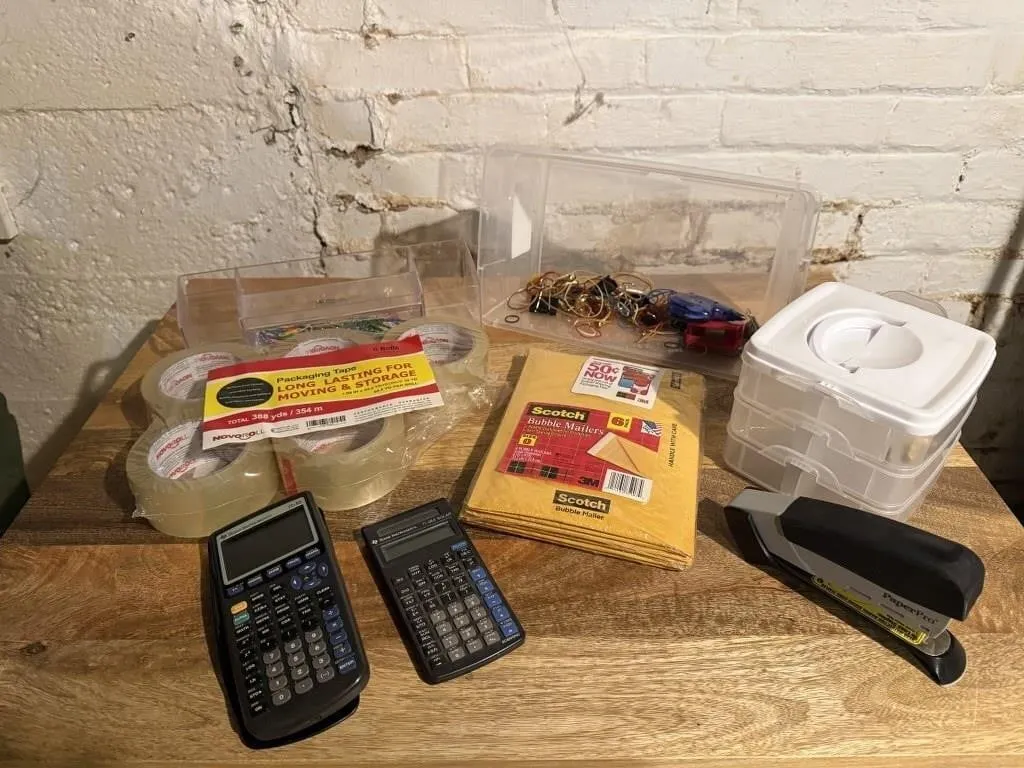 Scientific calculators, stapler, rolls of packing