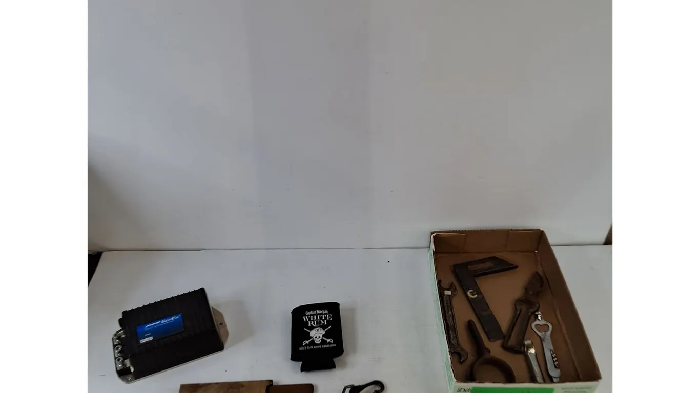 Traction Control Untested As-Is, Captain Morgan Drink Sleeve, (2) Bottle Openers, Hitch Ring, Tools