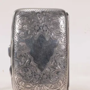 Antique Edwardian sterling silver cigarette case with British hallmarks of 1909 and intricate scroll