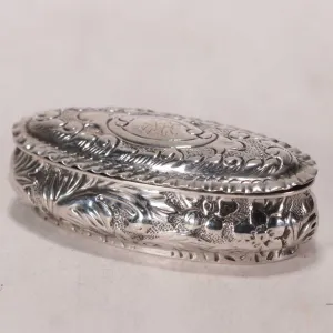 Antique Edwardian sterling silver snuff box with repousse decoration and stamped Birmingham 1907