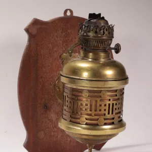 Vintage/ antique brass wall mounted oil lamp marked "English Make", 12" in height, mounted on wooden