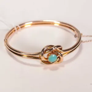 Antique Victorian 9ct yellow gold, love knot design hinged bracelet set with cabochon turquoise ston