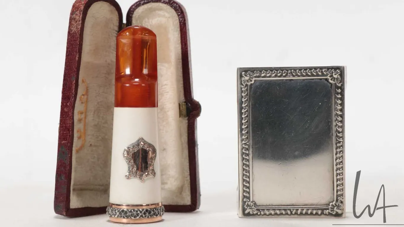 Antique Edwardian amber and Meerschaum cigar holder in fitted leather case and a Birks sterling silv