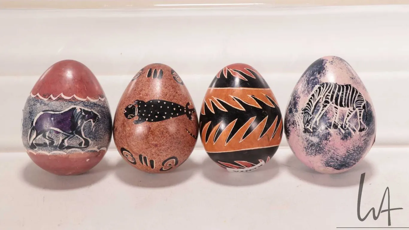 Four African made, hand carved stone eggs