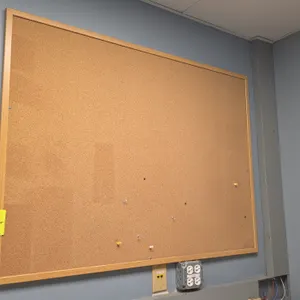 Assorted cork bulletin boards. Features wood and aluminum frames. Wall-mountable. Note: Frame damage present on select boards including bent metal and
