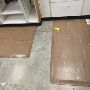 Rubber anti-fatigue mats. Features brown marble-pattern surface with beveled edges. 60" x 36" each. Note: Edges show tears.