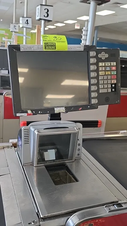 NCR and various point of sale systems. Includes operator POS terminals with integrated keypads, NCR 7878-2000 bi-optic scanner/scales, secondary displ