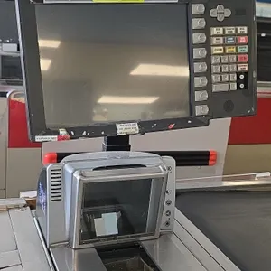NCR and various point of sale systems. Includes operator POS terminals with integrated keypads, NCR 7878-2000 bi-optic scanner/scales, secondary displ