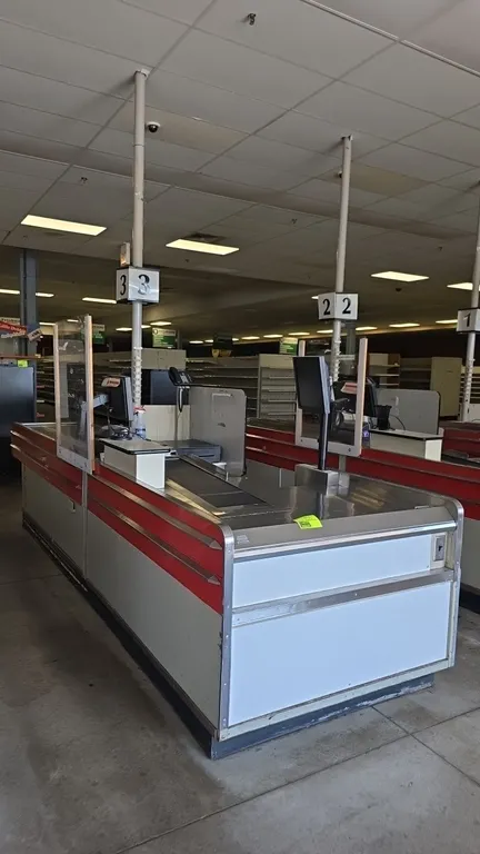 Borroughs Series 80 dual belt checklane. Features dual motorized conveyor belts, stainless steel decking and trim, cashier workstation with undercount