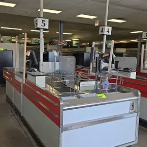 Borroughs Series 80 dual belt checklane. Features front and rear conveyor belts, wire bag racks, cashier station with cash drawer, monitor mount, clea