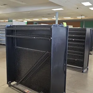 Portable metal candy and magazine merchandisers. Features black metal construction, pegboard backing, and slanted wire display shelving. Measures 50" 