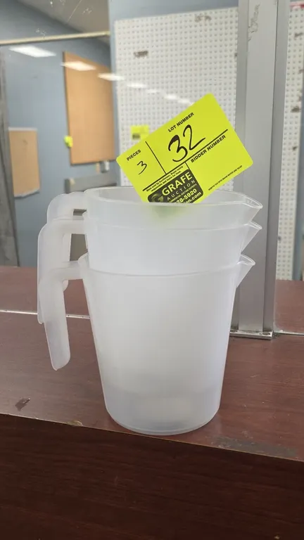 1 qt polypropylene pitchers. Features translucent plastic construction, molded open-loop handles, and integrated pour spouts.