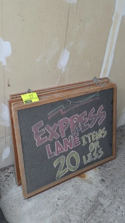 Wood frame dual-sided chalkboards. Features dual-sided chalkboard surfaces and attached metal hanging chains. 32" x 24".