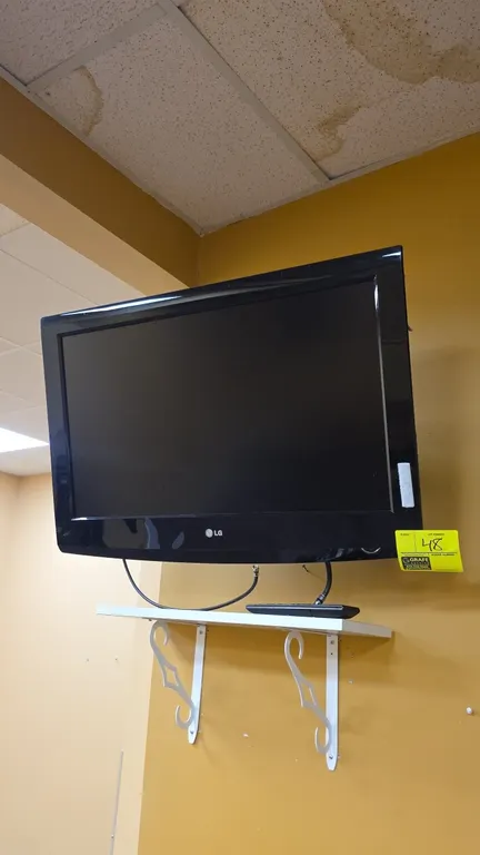LG 32" flat screen TV. Includes remote control and wall mounting bracket.