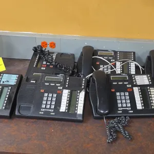 Nortel Networks office phones with backroom phone system. Includes digital desk phones (Model T7316) featuring multi-line LCD displays and programmabl