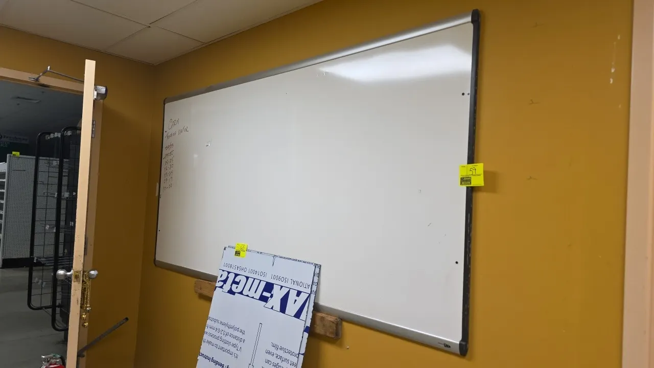 Aluminum frame dry erase whiteboard. Features a white marker surface and silver-tone aluminum trim. 96" x 48". Designed for wall mounting.