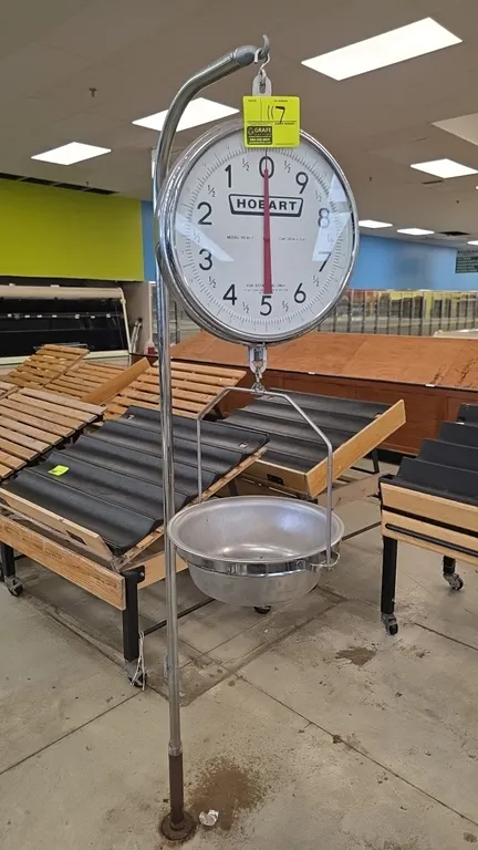 Hobart PR30-1 hanging dial food scale. Features 30 lb capacity with 1 oz graduations and hanging stainless steel pan. 84"H. Mounted on a floor post.