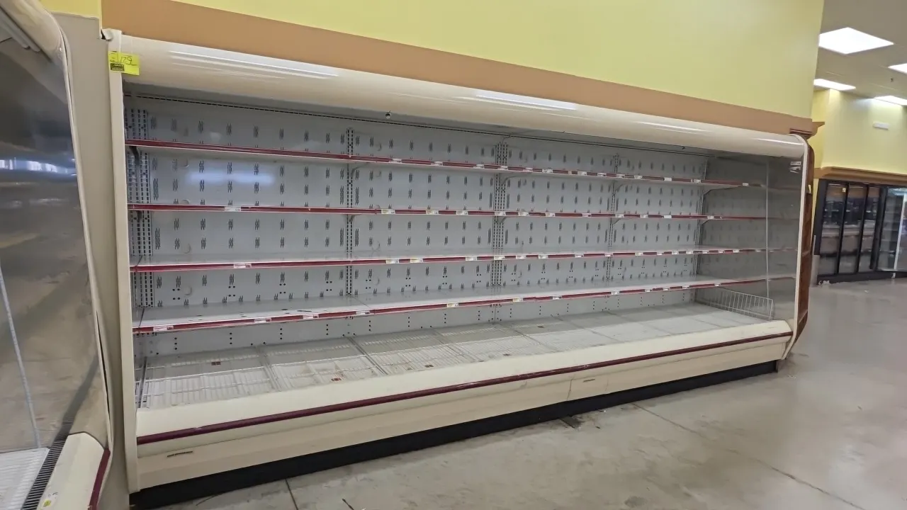 Hillphoenix O5DM8 multi-deck open dairy cases. Features multi-tier adjustable shelving with pricing channels, wire deck grates, and canopy lighting. 8