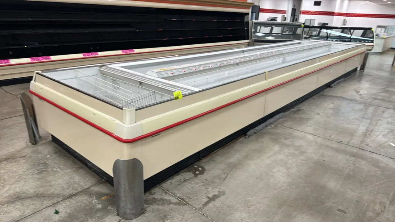 2008 Hillphoenix OWIZ low-temp double-wide island display cases. Features wire rack shelving, product dividers, bumper guard trim, and gas defrost. Li