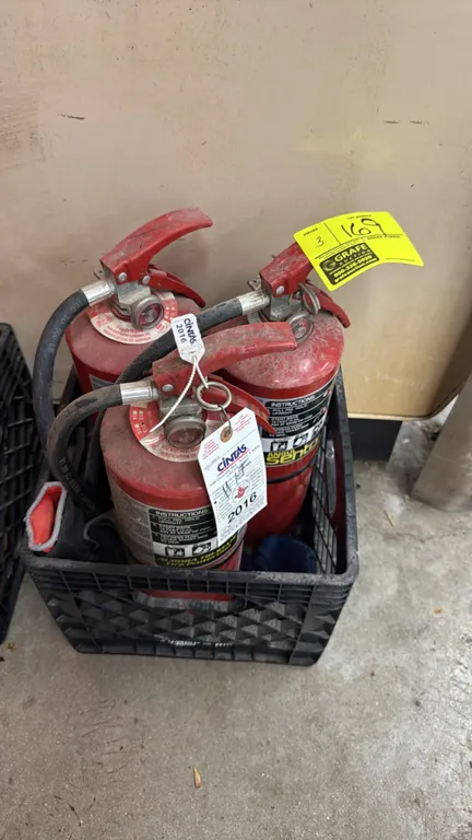 Ansul Sentry 10 lb dry chemical fire extinguishers. Features squeeze-grip lever operation, pressure gauges, and flexible discharge hoses. Includes bla
